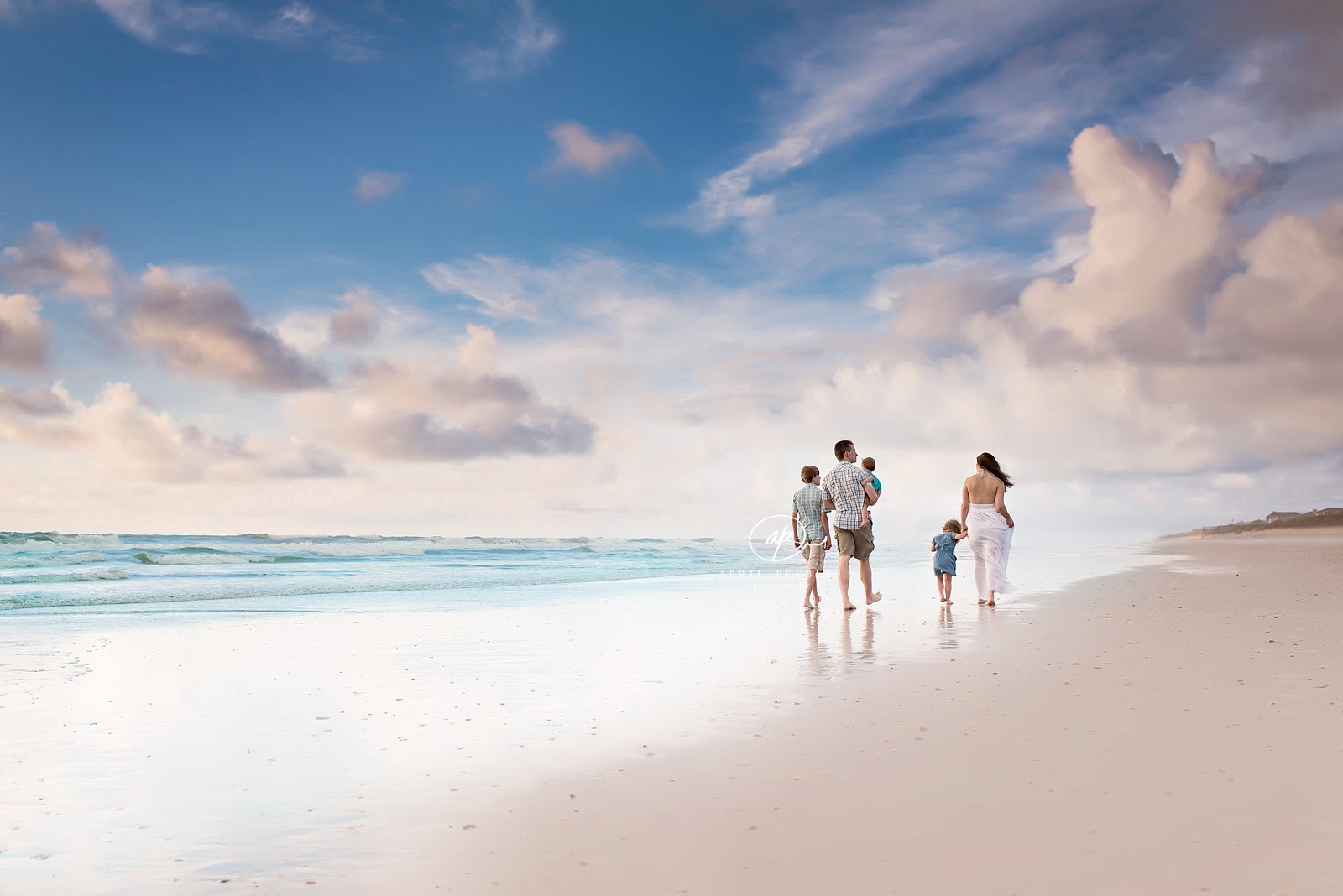 family walking on beach in ponte vedra