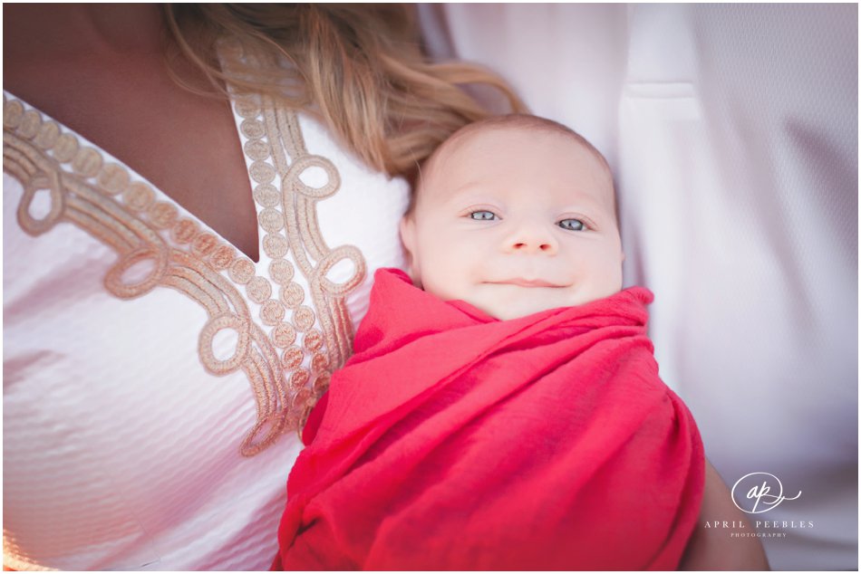 two month old baby photo being held by mom and dad in jacksonville